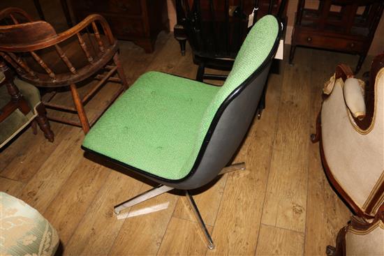 A green upholstered swivel chair